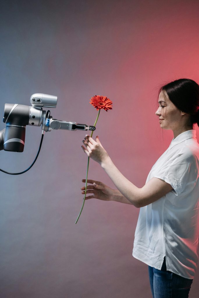 Photo by Pavel Danilyuk: https://www.pexels.com/photo/a-robot-holding-a-flower-8438979/